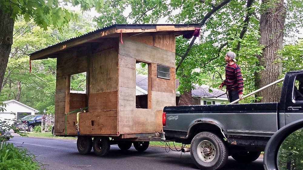 Towing the Micro house down the road to complete it on site