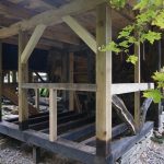 A timber frame of white and red oak, ash, cherry, maple and pine.